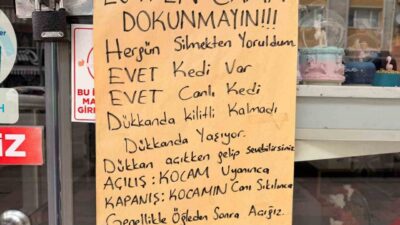 Afyonkarahisar’da cam silmekten yorulan bir esnafın karısının iş yerinin vitrini